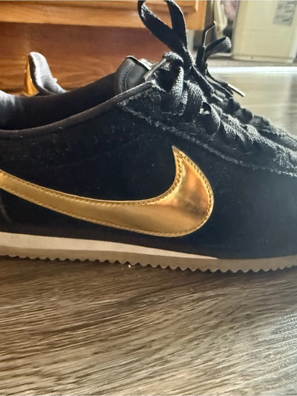 Nike Men’s Black Suede Sneakers with Gold Swoosh